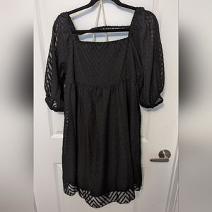 Black fun flirty dress with puffy see through sleeves.